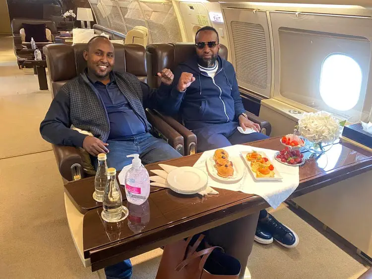 Mombasa Governor Hassan Joho (right) and Suna East MP Junet Mohammed on board a private jet enroute to Dubai to visit ODM party leader Raila Odinga: Peep the brown bag under the table