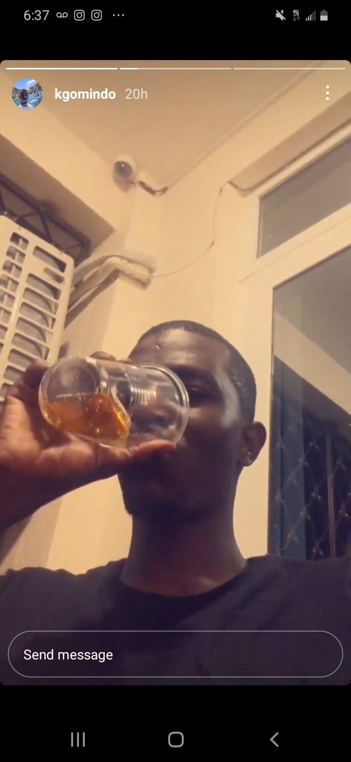 CAPTION: Kevin Omindo enjoys a drink inside his Mombasa apartment as shared on his Instagram page