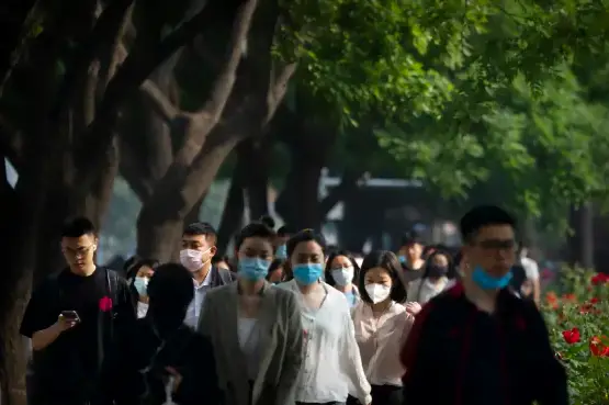 An image showing Beijing Commuters wearing face mask as the country is hit by a new wave of Covid 19 Reseachers say