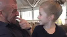 An image of Murphy Claire Levesque with her father Triple H