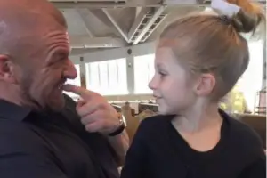 An image of Murphy Claire Levesque with her father Triple H