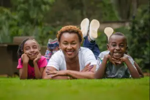 An image of Sylvia Mulinge alongside her two children; a girl and a boy