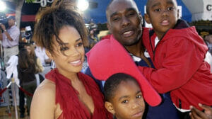 An image of Morris Chestnut with his wife and children
