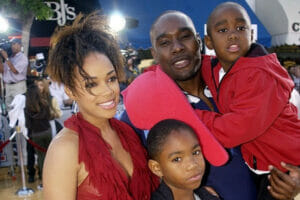 An image of Morris Chestnut with his wife and children