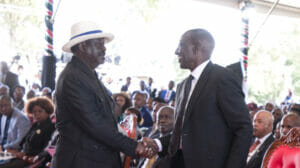 An image of Raila Odinga shaking Ruto's hand at a past event