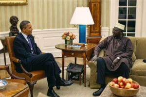 An image of Malik Obama and Barack Obama at the White House