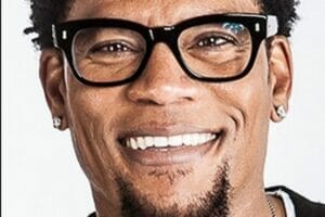 DL Hughley Net Worth: Learn how the comedian and actor made his fortune by starring in movies, TV shows, comedy specials, books, and podcasts.