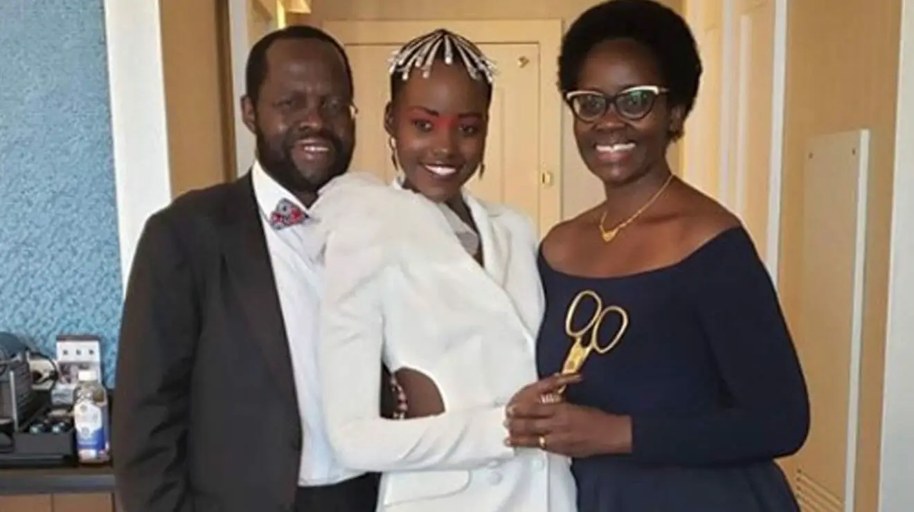 Lupita Nyango Posses with Her parents