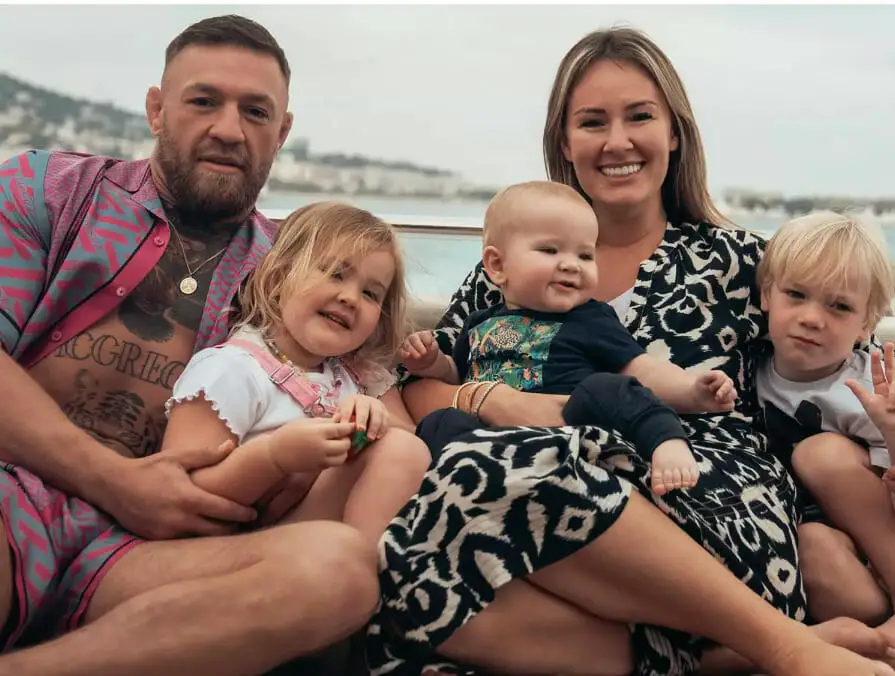 An image of Conor McGregor, his wife Dee Devlin, and their children