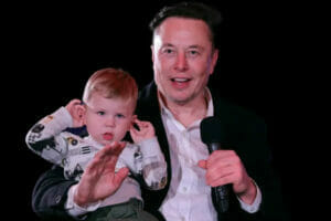 An image of Elon Musk with one of his kids