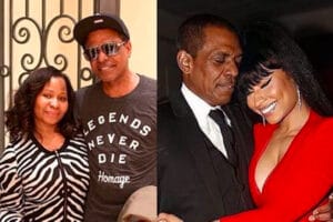 A family photo of Nicki Minaj with her parents, Robert and Carol Maraj, smiling at the camera.