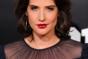 Cobie Smulders, renowned actress, posing for a promotional photo with elegance and style.