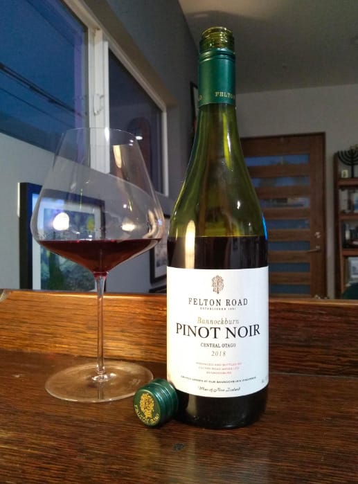 A glass of elegant Pinot Noir wine, showcasing its deep red color and exquisite taste.