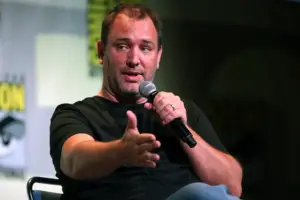 Trey Parker, co-creator of South Park and The Book of Mormon,with a microphone on stage.