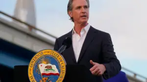 Image of Gavin Newsom, California's Governor, delivering a speech at a podium.